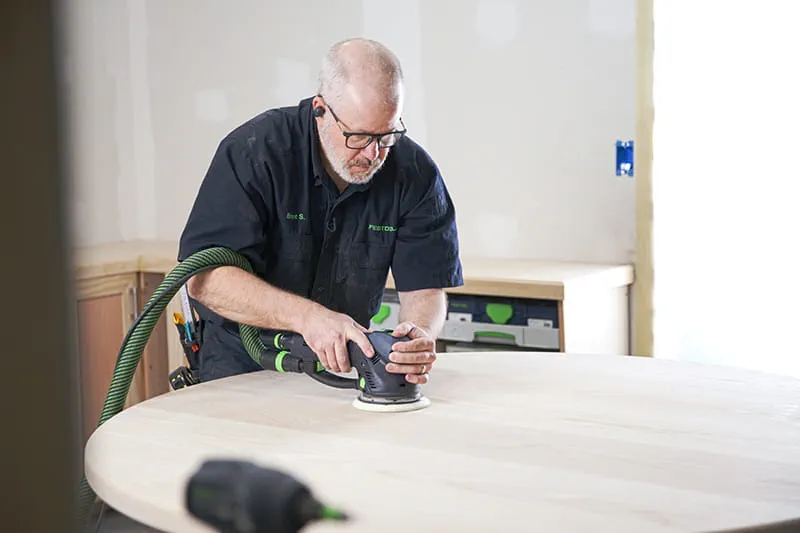 Brent using a sander
