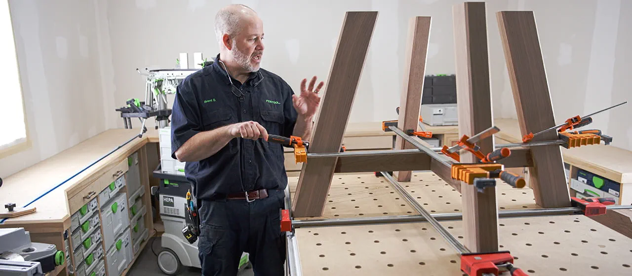 Brent putting table legs together